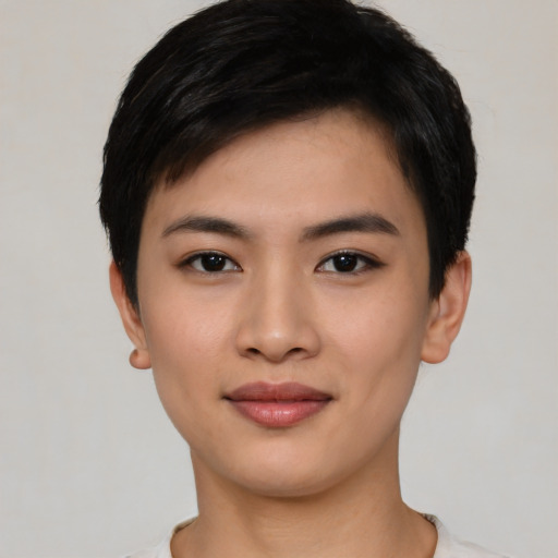 Joyful asian young-adult female with short  black hair and brown eyes