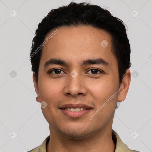 Joyful latino young-adult male with short  black hair and brown eyes