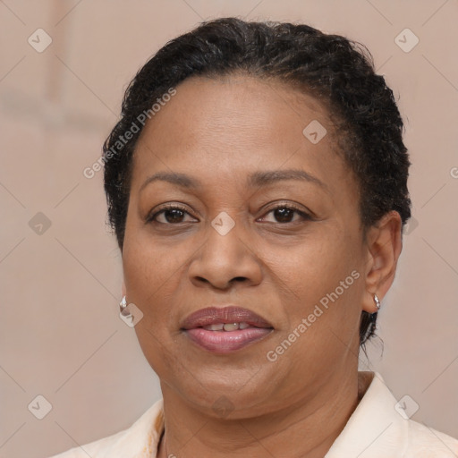 Joyful latino adult female with short  brown hair and brown eyes