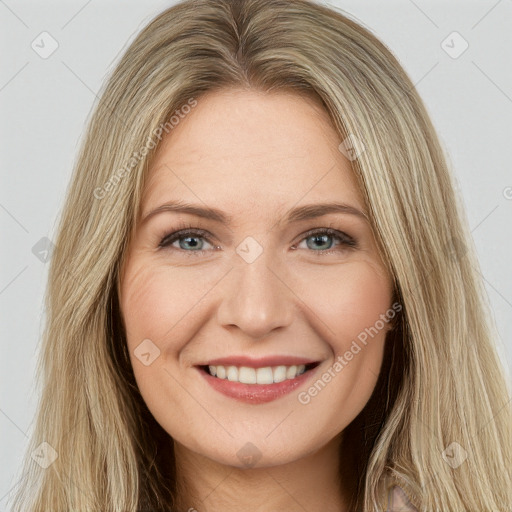 Joyful white young-adult female with long  brown hair and green eyes