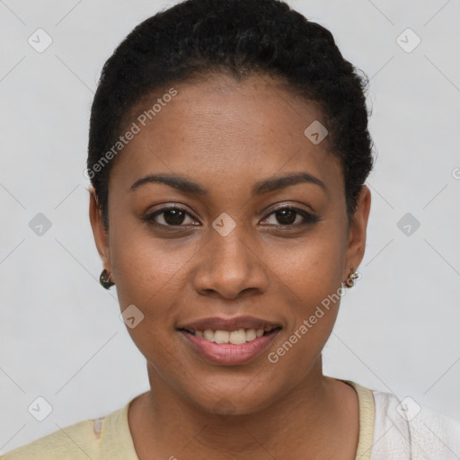 Joyful black young-adult female with short  black hair and brown eyes