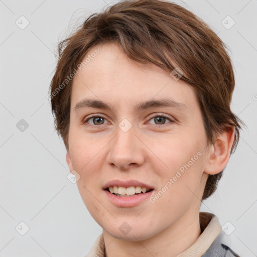 Joyful white young-adult female with short  brown hair and grey eyes