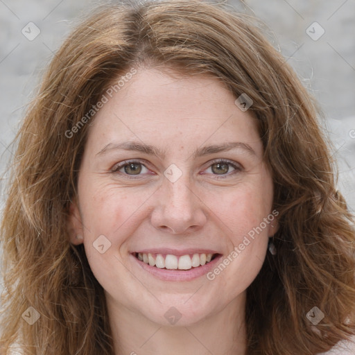 Joyful white young-adult female with long  brown hair and green eyes