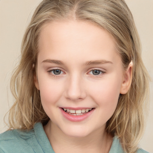 Joyful white child female with medium  brown hair and grey eyes