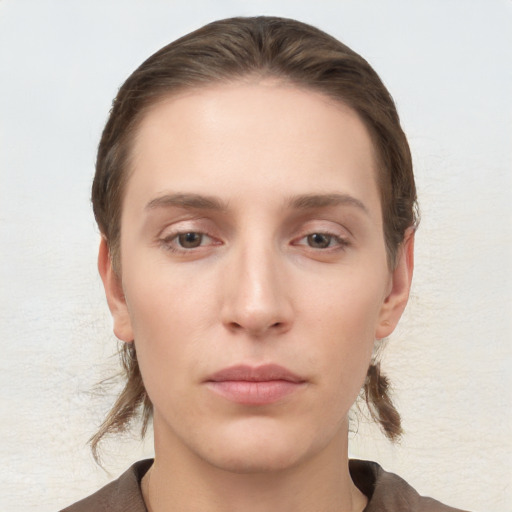 Neutral white young-adult female with short  brown hair and grey eyes