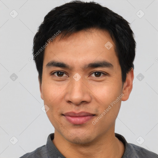 Joyful asian young-adult male with short  black hair and brown eyes