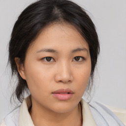 Neutral asian young-adult female with medium  brown hair and brown eyes