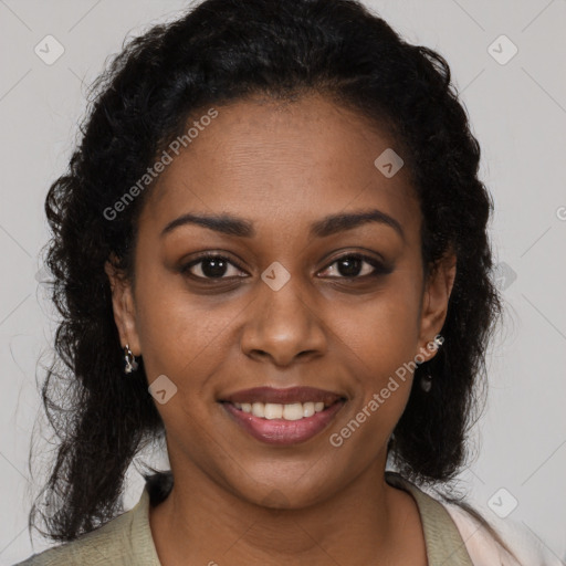 Joyful black young-adult female with long  brown hair and brown eyes