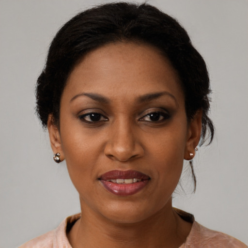 Joyful black young-adult female with medium  brown hair and brown eyes