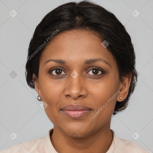 Joyful black adult female with short  brown hair and brown eyes