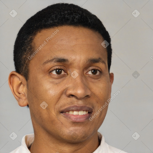 Joyful latino young-adult male with short  brown hair and brown eyes