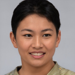 Joyful asian young-adult female with short  brown hair and brown eyes