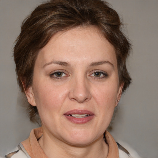 Joyful white adult female with medium  brown hair and brown eyes