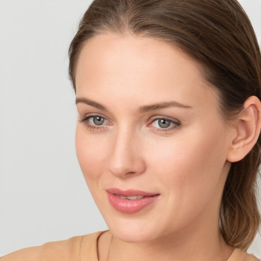 Joyful white young-adult female with long  brown hair and grey eyes