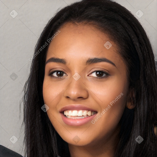 Joyful latino young-adult female with long  black hair and brown eyes