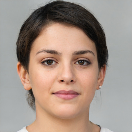 Joyful white young-adult female with medium  brown hair and brown eyes