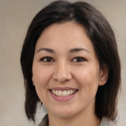 Joyful white adult female with medium  brown hair and brown eyes