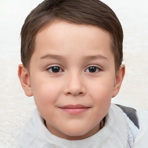 Joyful white child male with short  brown hair and brown eyes