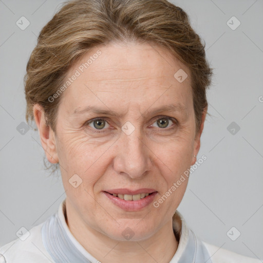 Joyful white adult female with short  brown hair and grey eyes