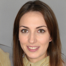 Joyful white young-adult female with medium  brown hair and brown eyes