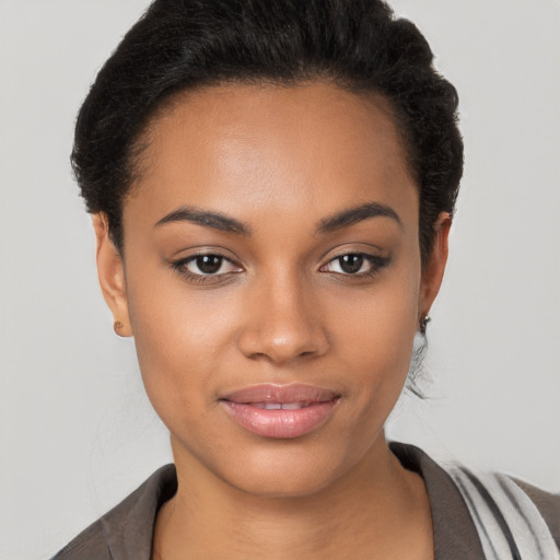 Joyful latino young-adult female with short  black hair and brown eyes