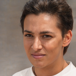 Joyful white adult female with short  brown hair and brown eyes