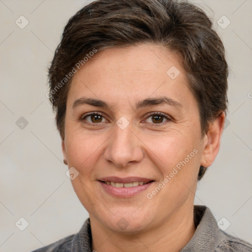 Joyful white adult female with short  brown hair and brown eyes