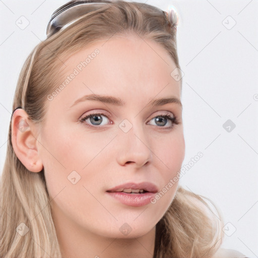 Neutral white young-adult female with long  brown hair and blue eyes