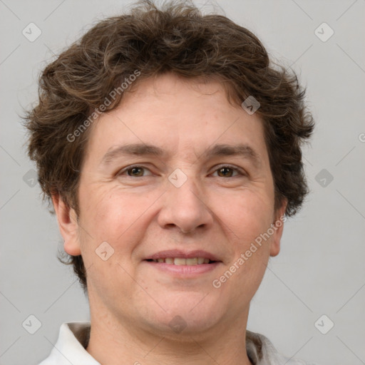 Joyful white adult male with short  brown hair and grey eyes