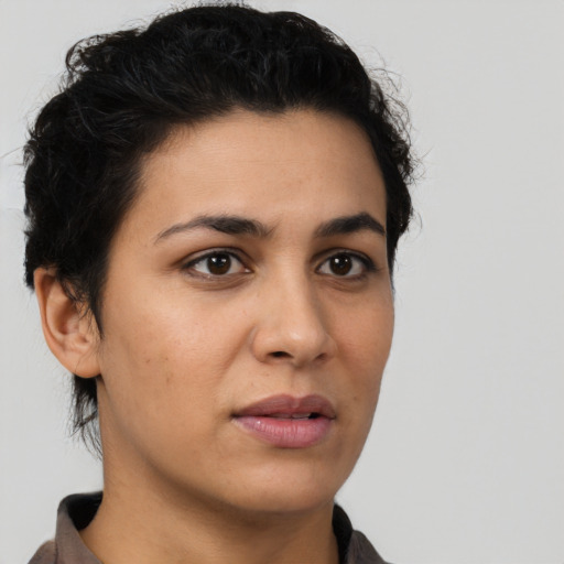Neutral latino young-adult female with short  brown hair and brown eyes