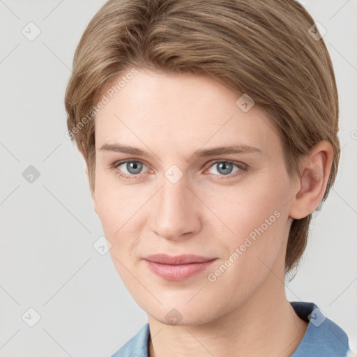 Joyful white young-adult female with short  brown hair and grey eyes