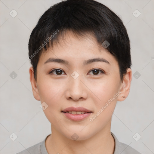 Joyful asian young-adult female with short  brown hair and brown eyes