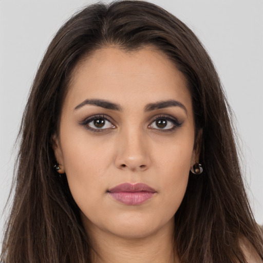 Neutral white young-adult female with long  brown hair and brown eyes