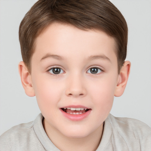 Joyful white child male with short  brown hair and brown eyes