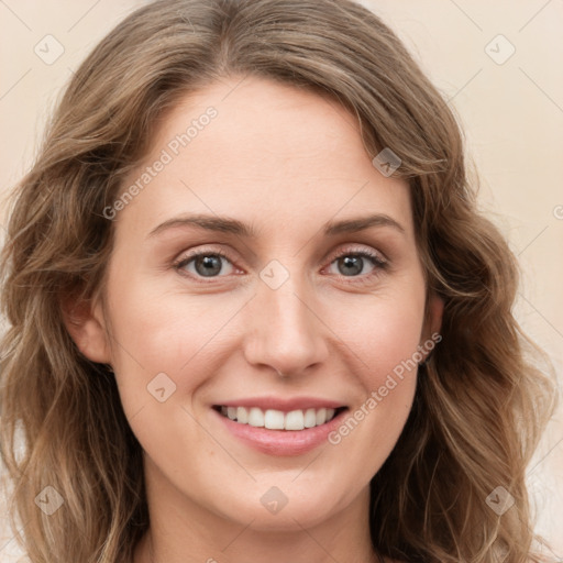 Joyful white young-adult female with long  brown hair and green eyes