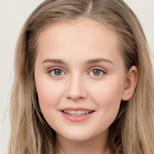 Joyful white young-adult female with long  brown hair and green eyes