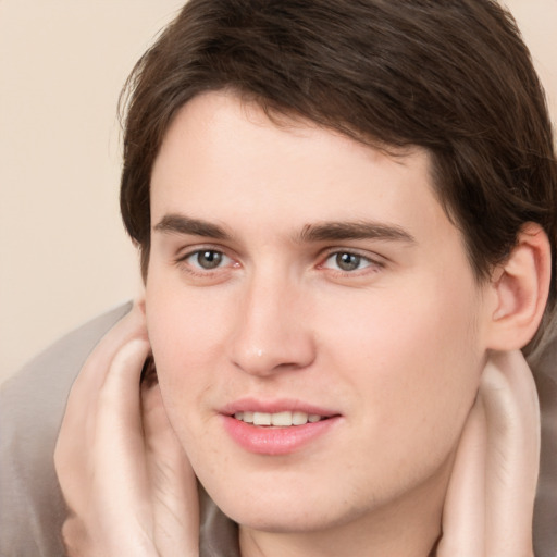 Joyful white young-adult male with medium  brown hair and brown eyes