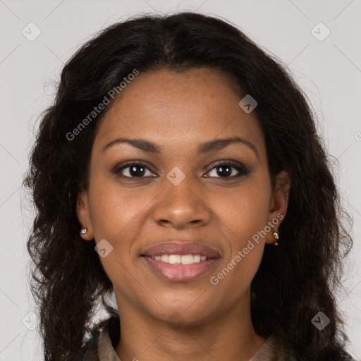 Joyful black young-adult female with long  brown hair and brown eyes