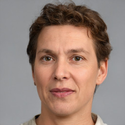 Joyful white adult male with short  brown hair and grey eyes