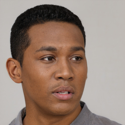 Neutral black young-adult male with short  black hair and brown eyes