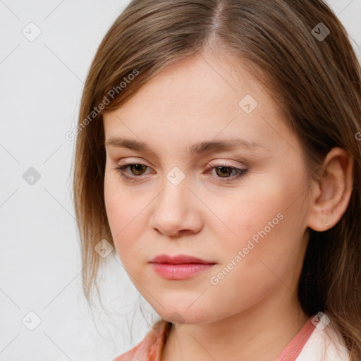 Joyful white young-adult female with medium  brown hair and blue eyes