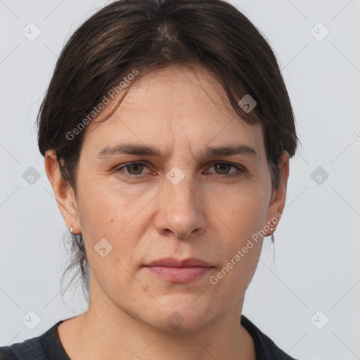 Joyful white adult female with medium  brown hair and brown eyes