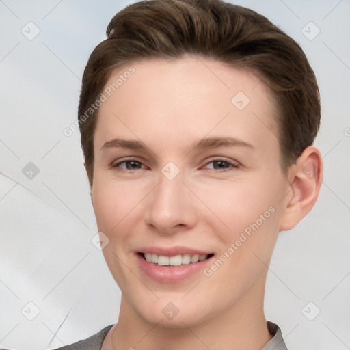 Joyful white young-adult female with short  brown hair and brown eyes