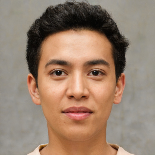 Joyful latino young-adult male with short  brown hair and brown eyes