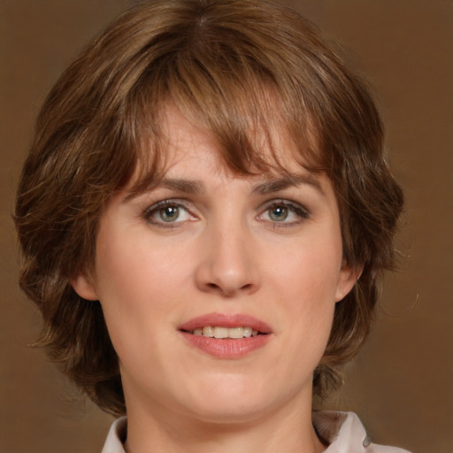 Joyful white young-adult female with medium  brown hair and green eyes