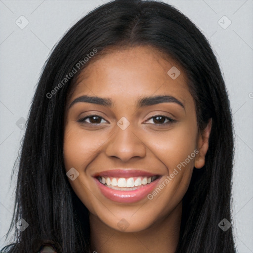 Joyful latino young-adult female with long  black hair and brown eyes