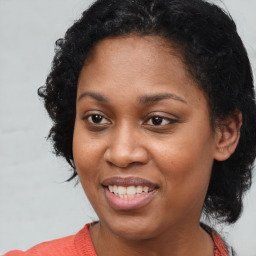 Joyful latino young-adult female with medium  black hair and brown eyes