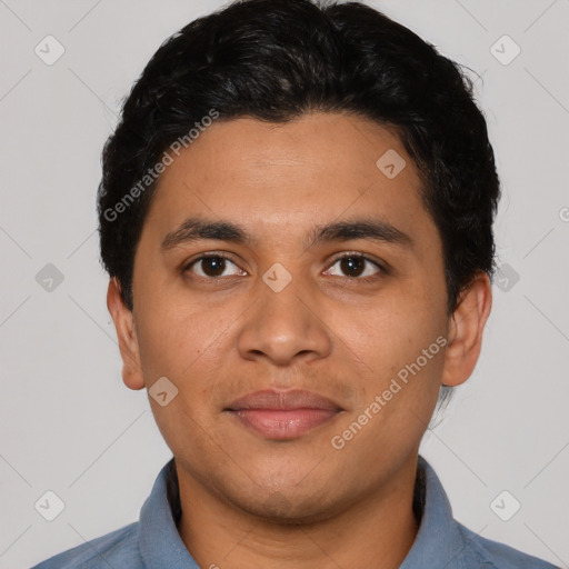 Joyful latino young-adult male with short  black hair and brown eyes