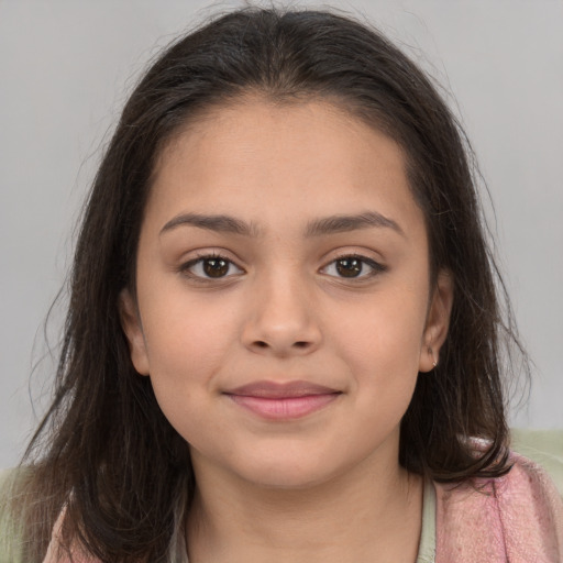 Joyful white child female with long  brown hair and brown eyes