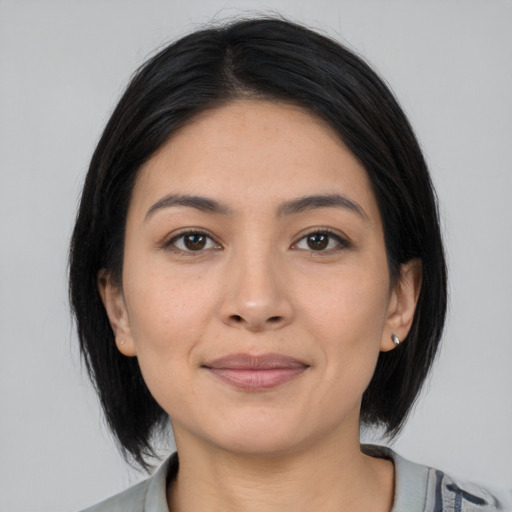 Joyful latino young-adult female with medium  black hair and brown eyes
